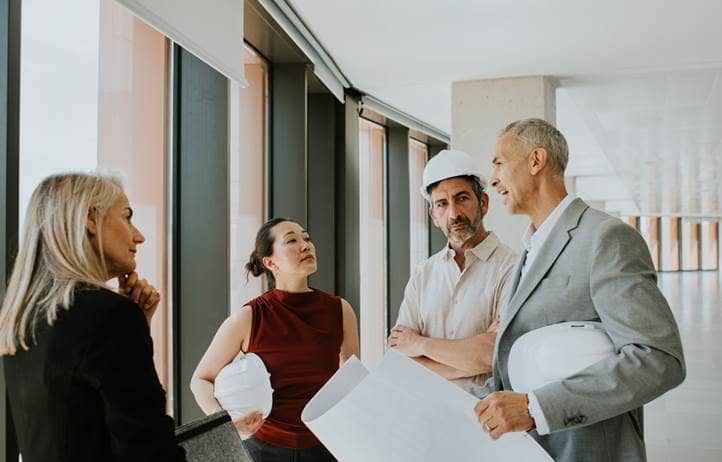 Construction experts talking with consultants.