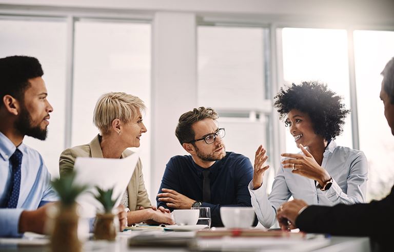 Business people talking at a meeting table