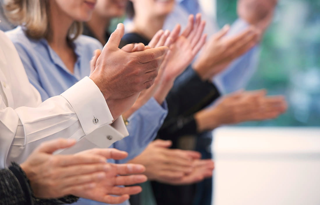 Image of people clapping