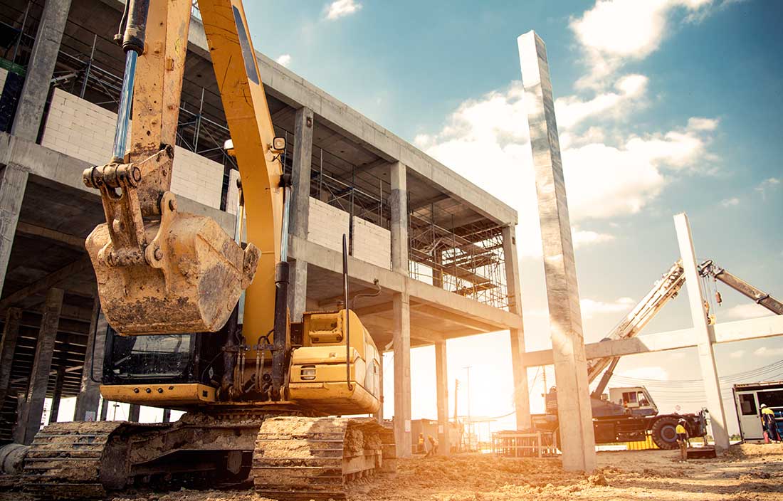 Construction project cost mitigation strategies; image of construction site with machinery