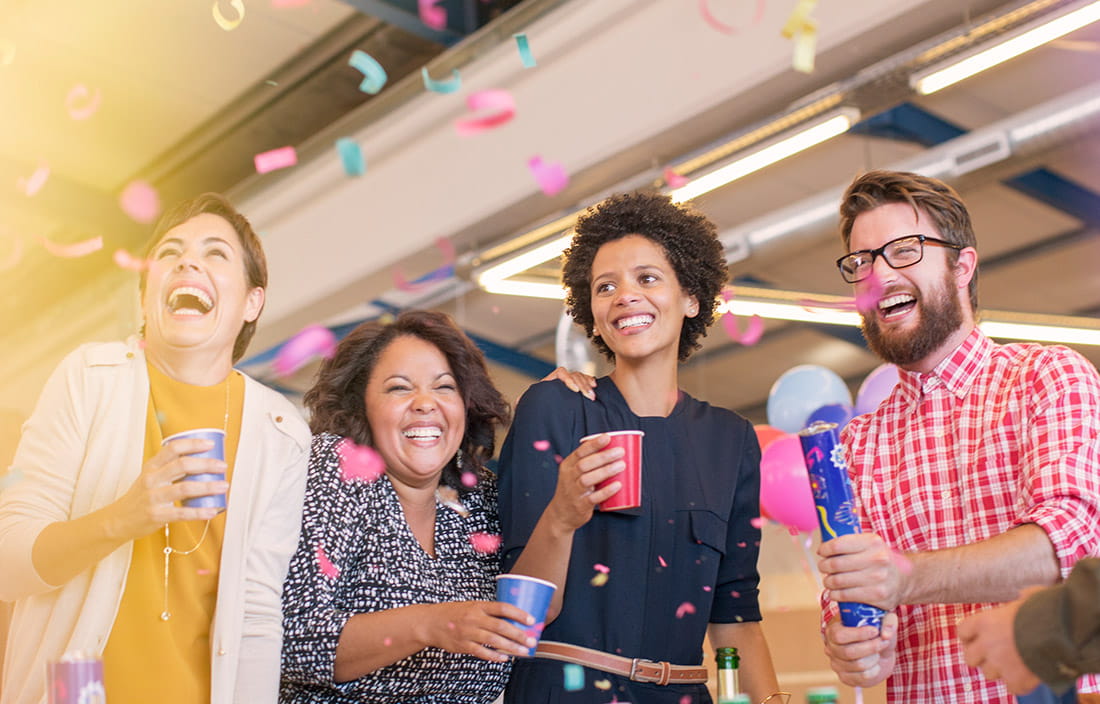 professionals celebrating in an office