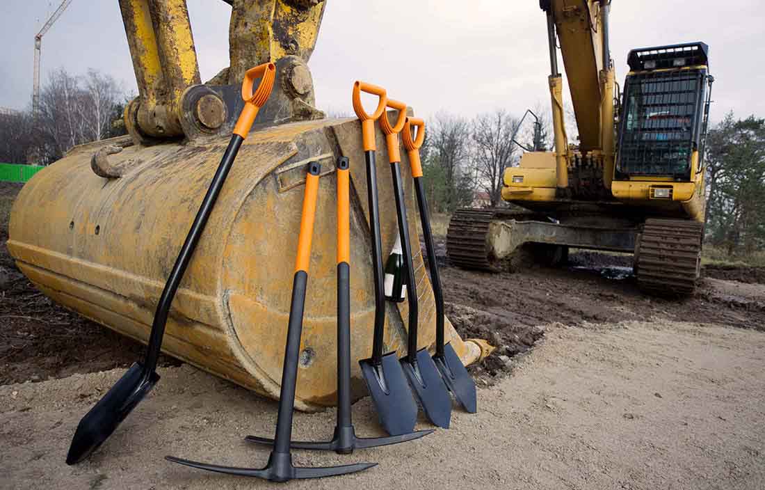 Groundbreaking of a construction project with tools and digger