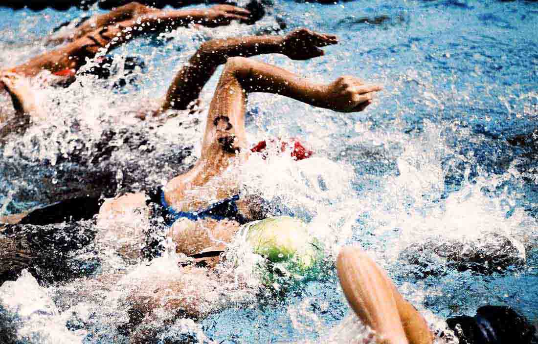 Teenagers swimming in a pool