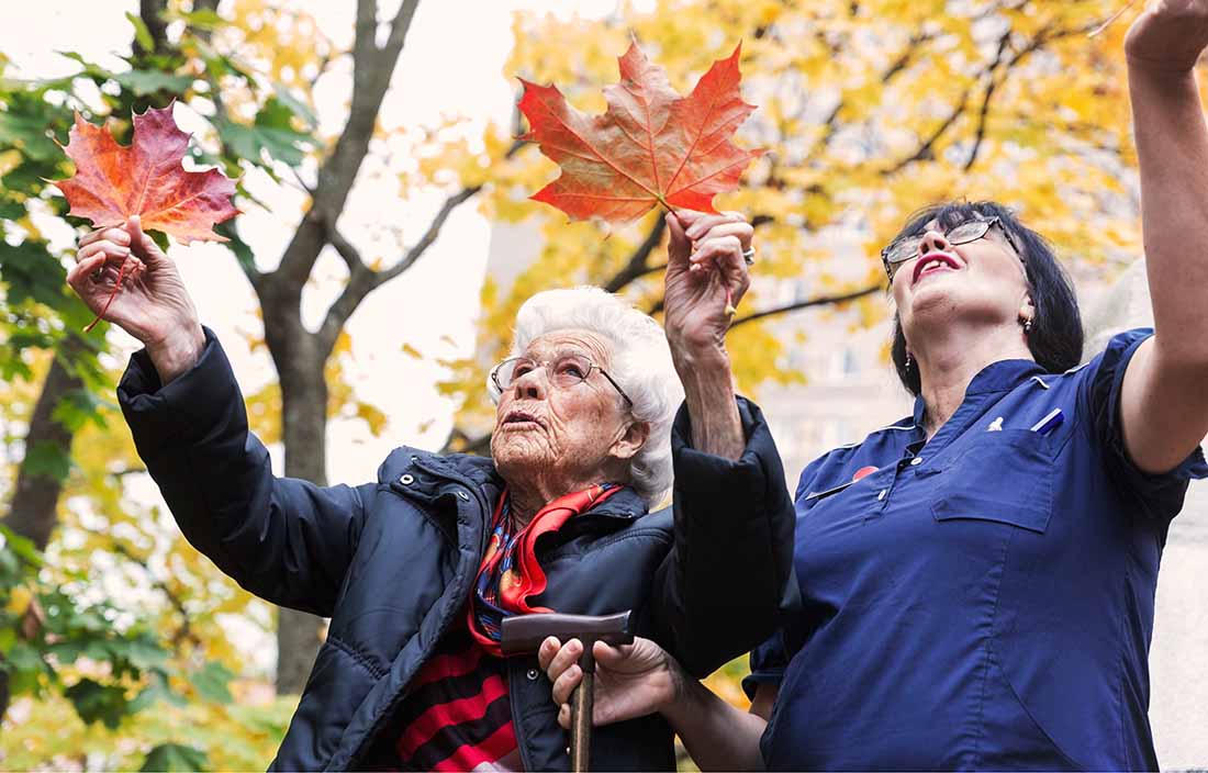 Photo of senior adult woman and a senior living caregiver