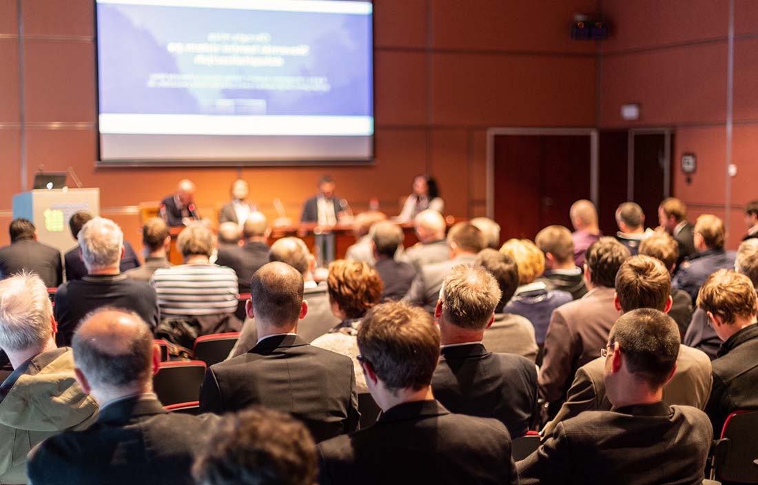 Experts presenting at a conference about senior living development and senior housing market trends