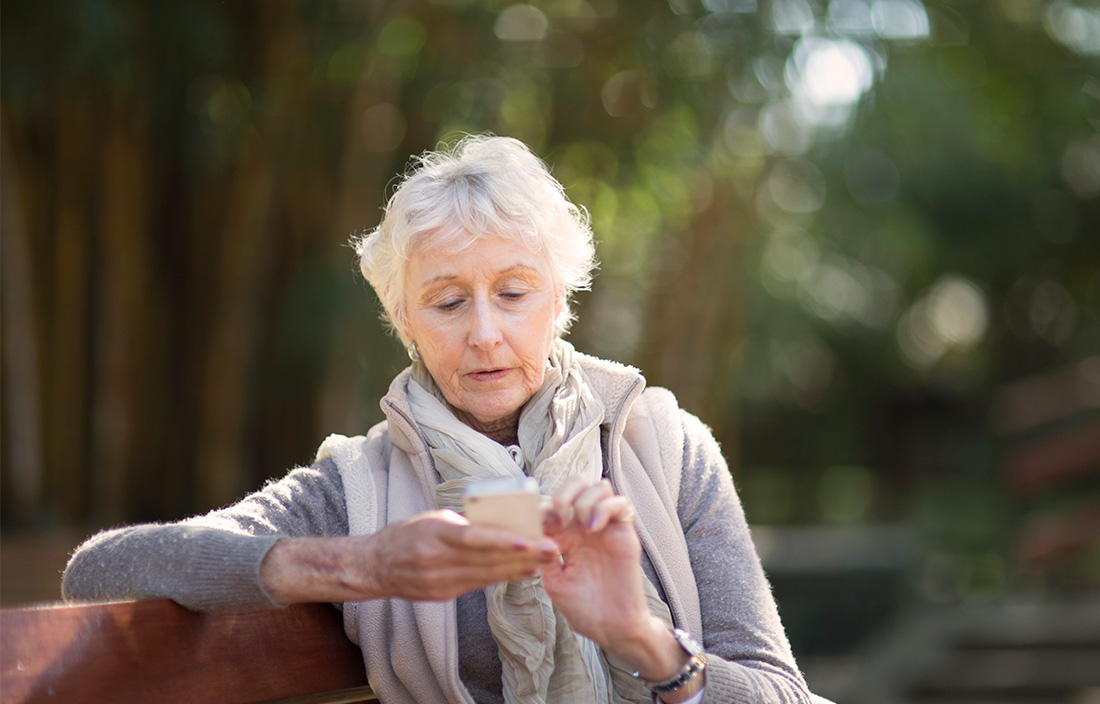 Image of a older woman using a smart phone 