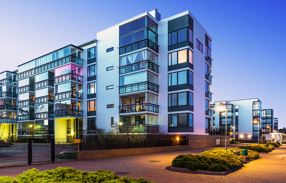 Modern senior living apartment building at dusk