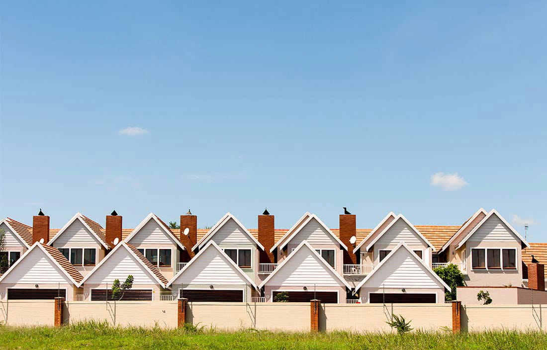 Long shot of similar houses in a row