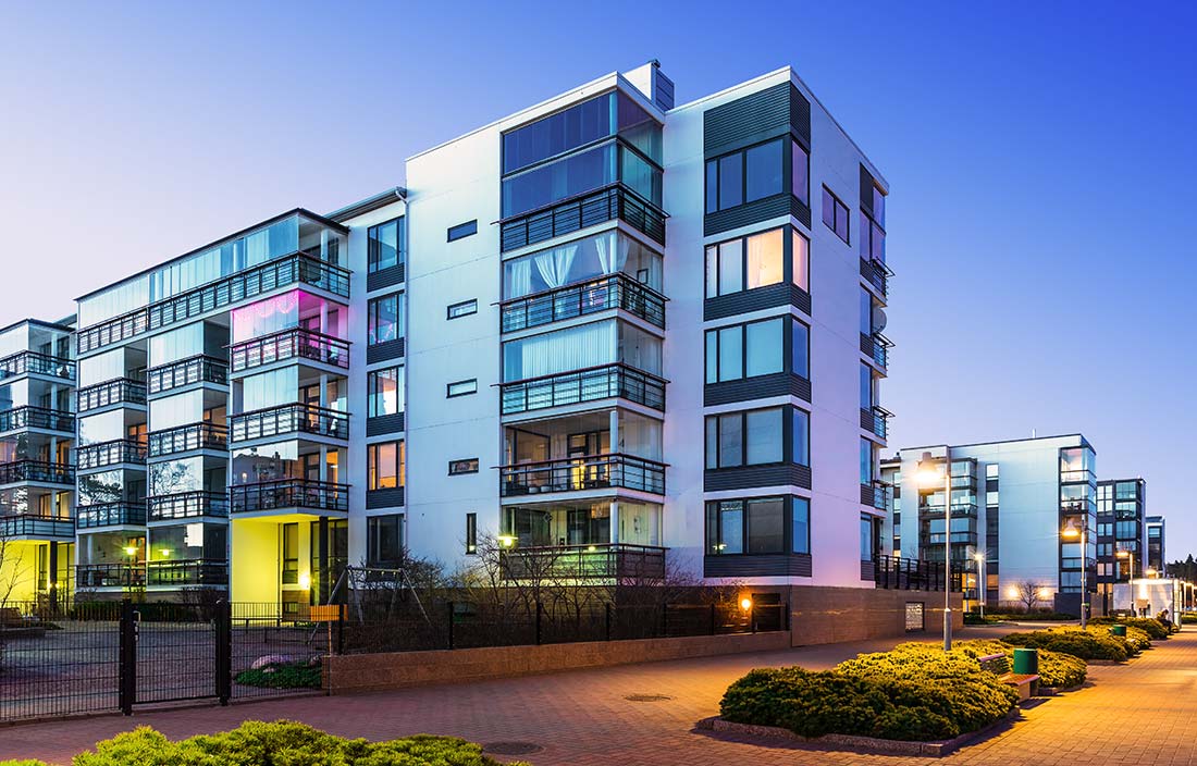 Photo of a modern, urban senior living development or apartment at dusk