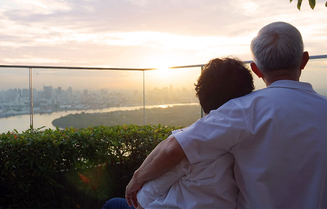 Image of senior man and woman watching sunset