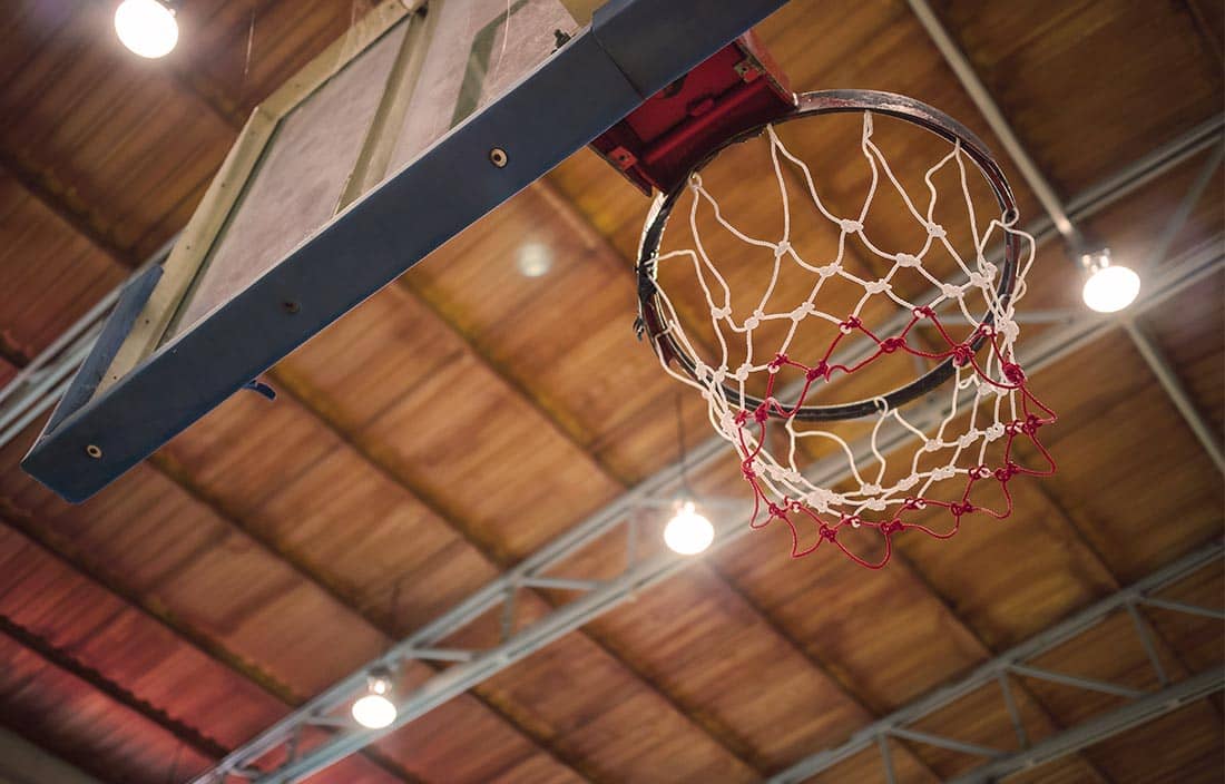 Photo of a basketball hoop as seen from below