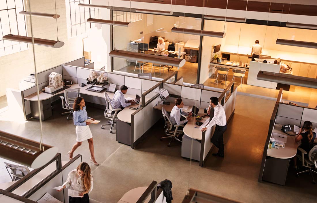 Three quarters overhead view of a busy modern office space