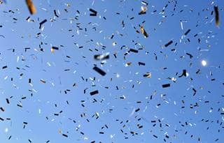Confetti against a blue sky background