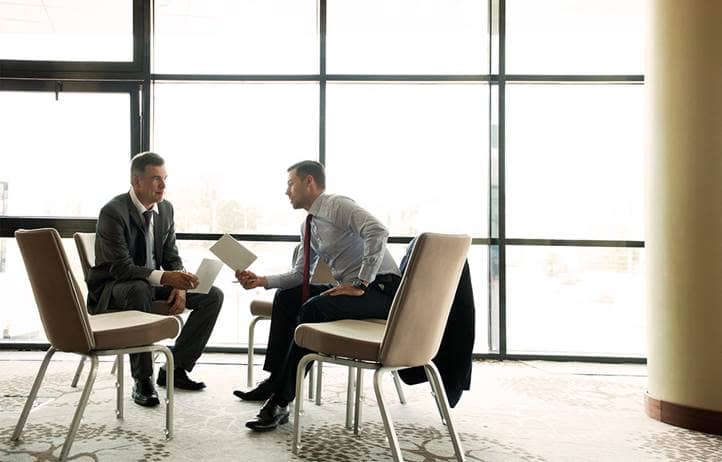 Real estate investing professionals discussing internal rate of return.