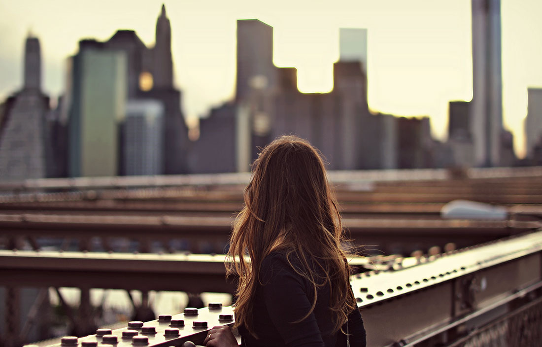 Woman overlooking a cityscape