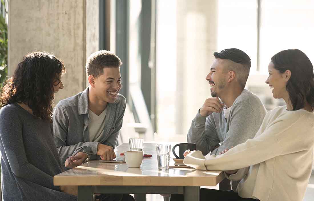 People sitting around a table talking