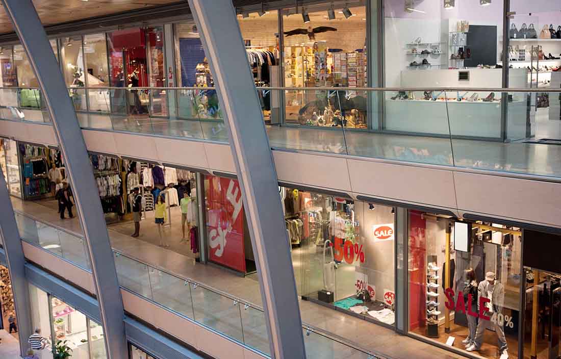 Empty shopping mall with store windows