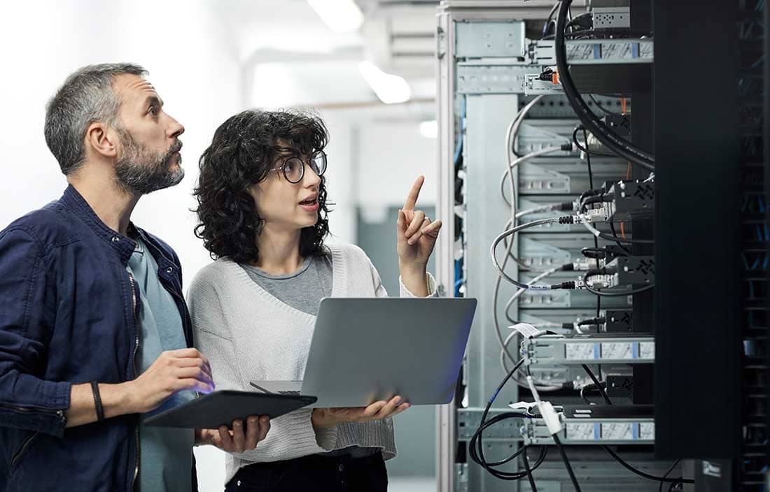 Man and woman with computers
