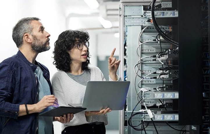Man and woman with computers