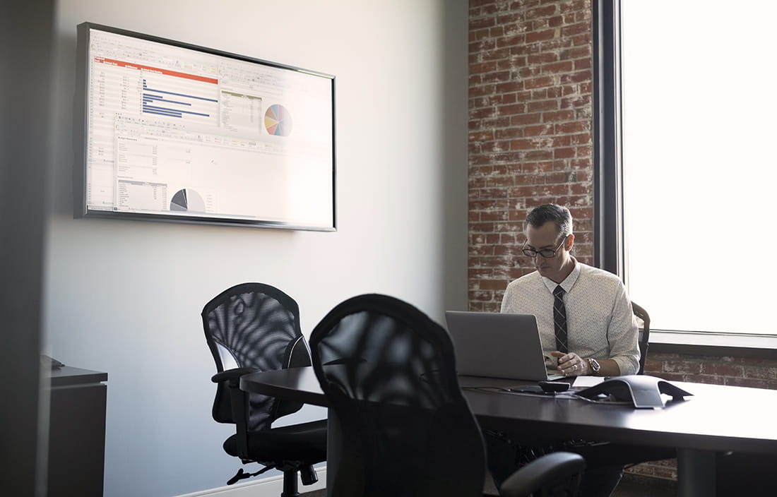 Man sitting in empty conference room