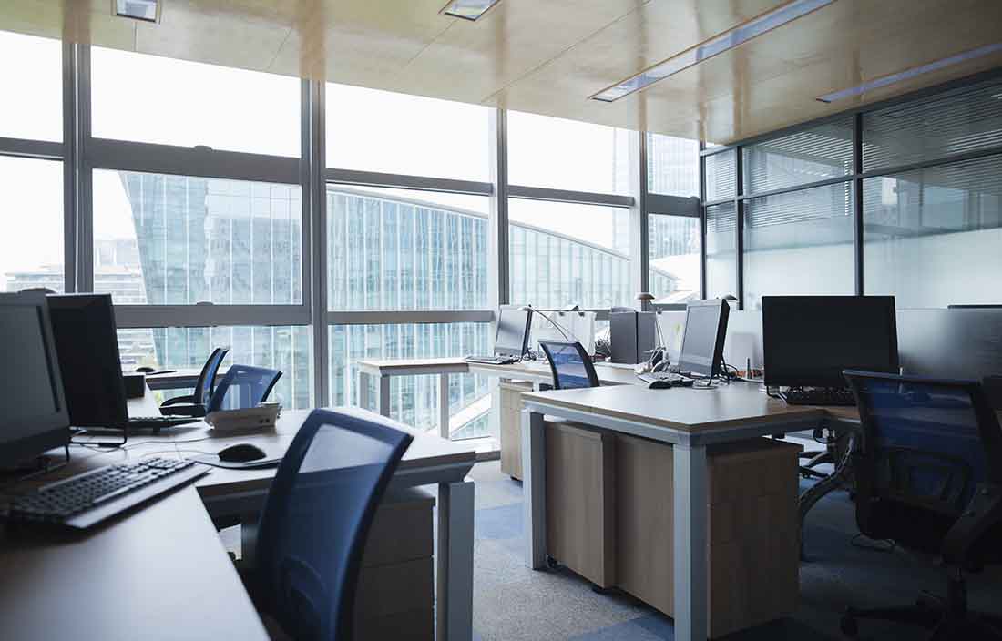 Empty office with desk and chairs