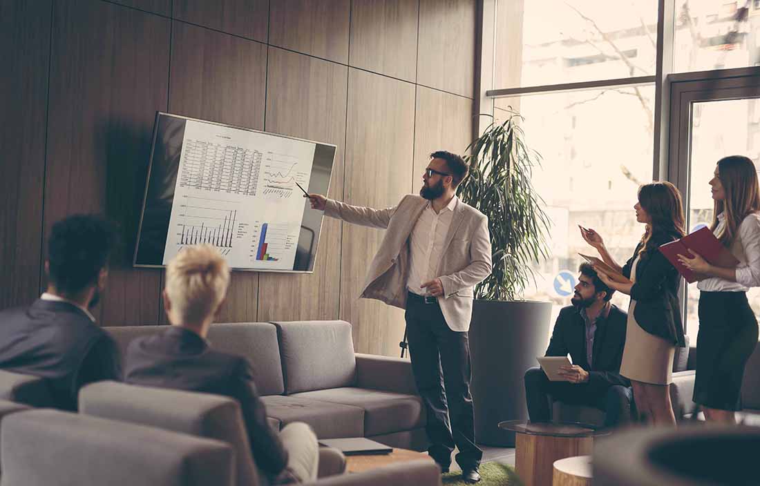People in a conference room discussing interest rates