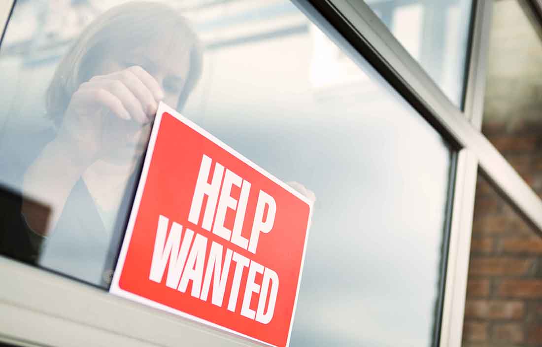 Help wanted sign outside building