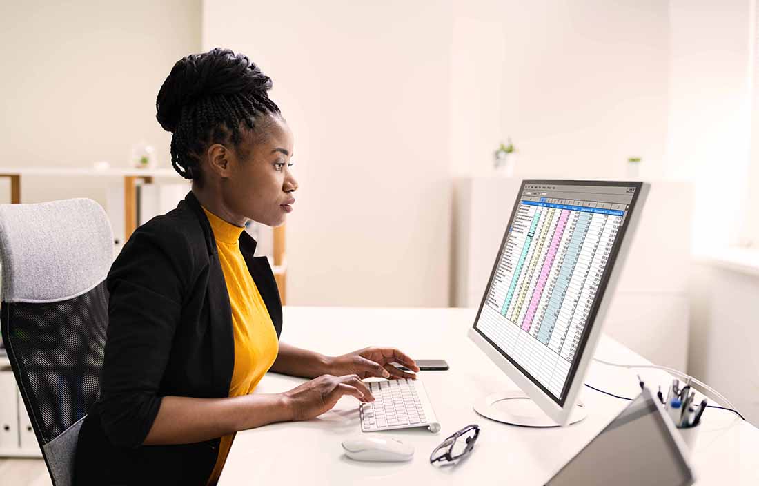 Person looking at computer with labor market data
