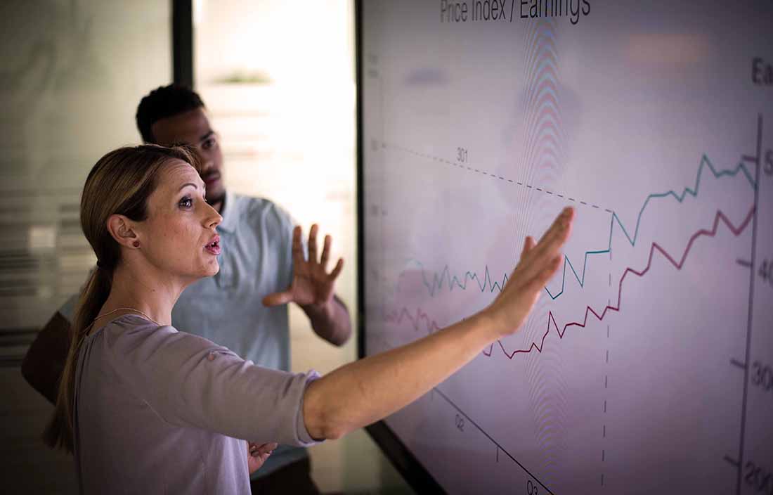 People reviewing a chart