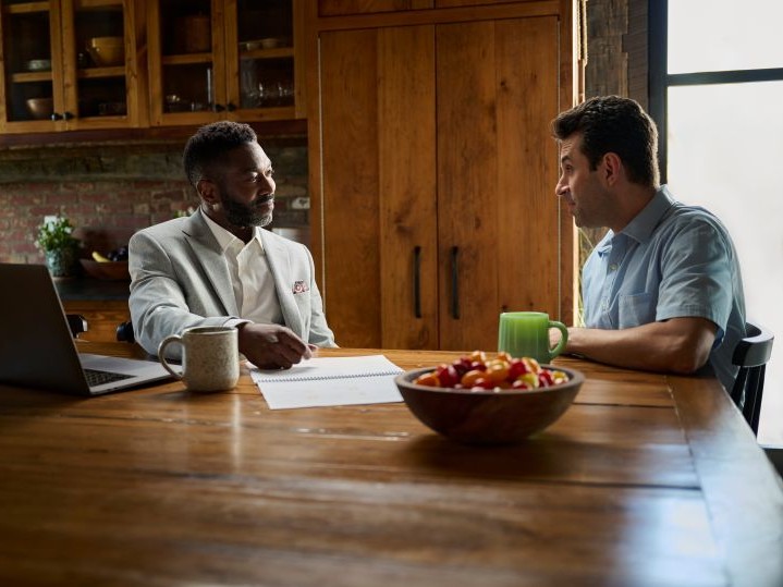Financial advisor sitting with their client.