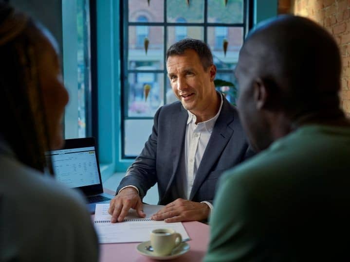 Financial advisor talking with their clients.