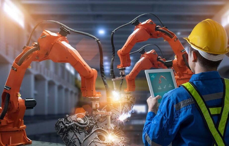 Manufacturing professional with robotic machinery