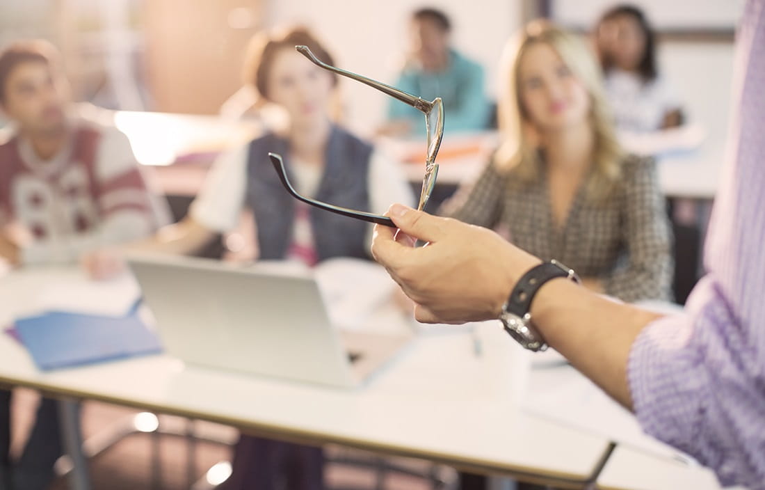 Image of professor lecturing to class.